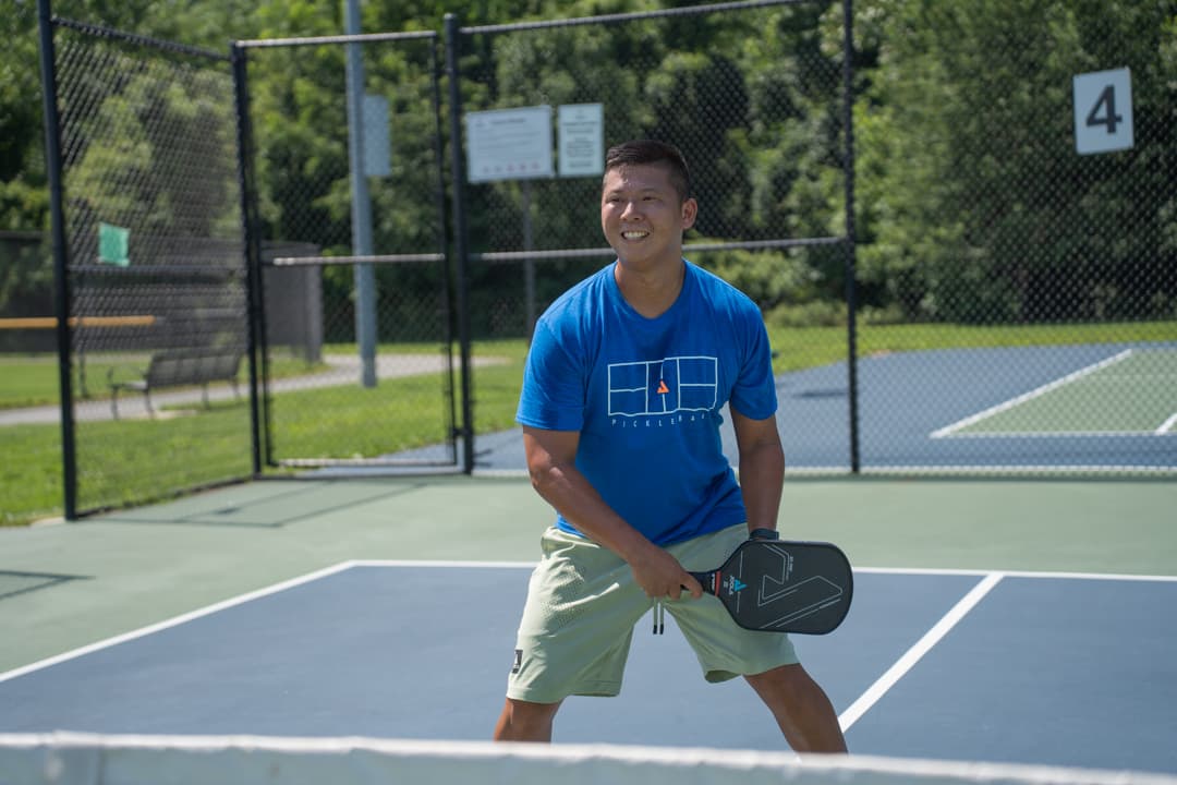 Sam Morris smiling on the court